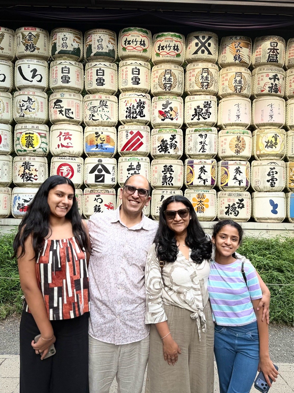 The family before the sake barrel wall at Meiji Jingu