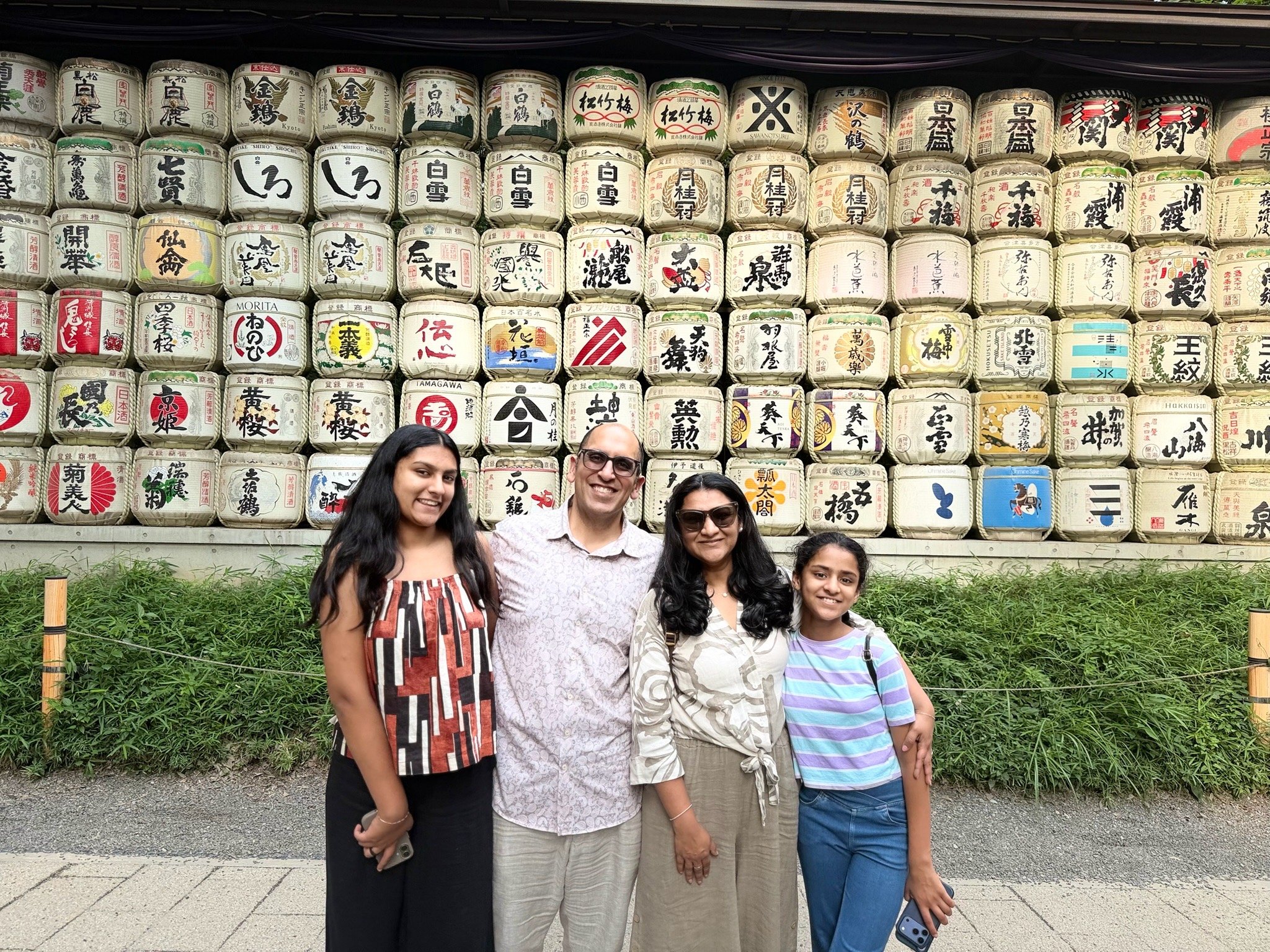 The family before the sake barrel wall at Meiji Jingu