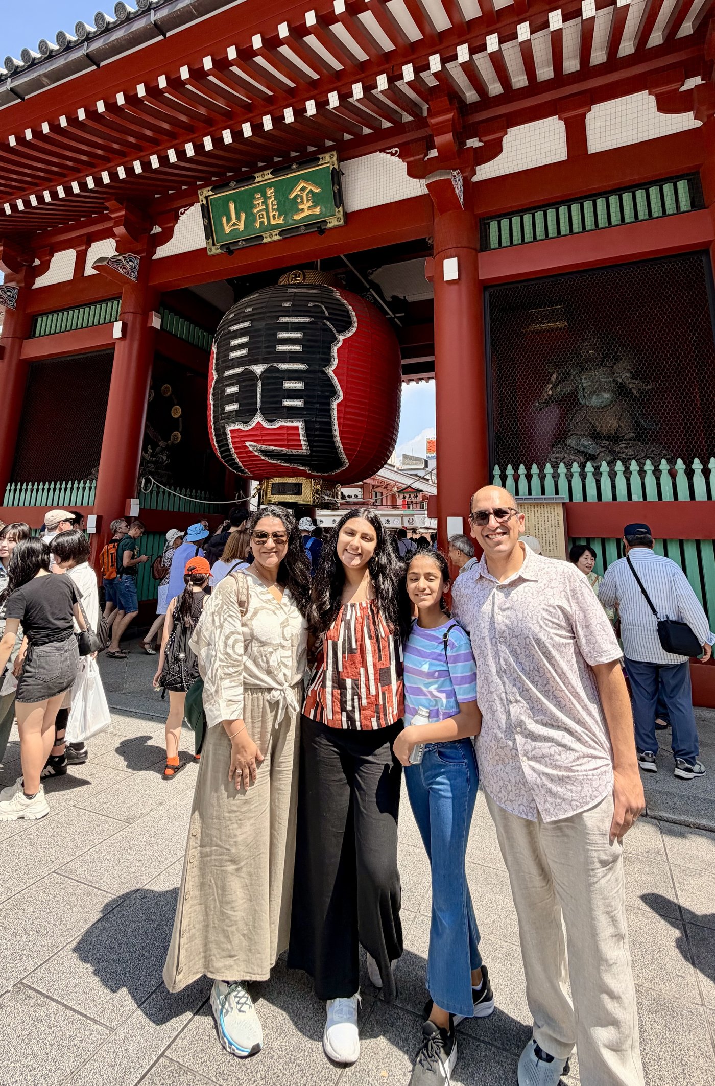 The family beneath the great red lantern of Kaminarimon gate in Asakusa