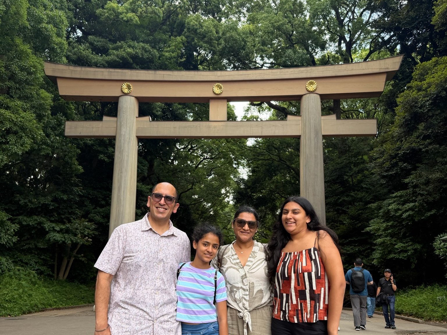 The family at the great torii of Meiji Jingu