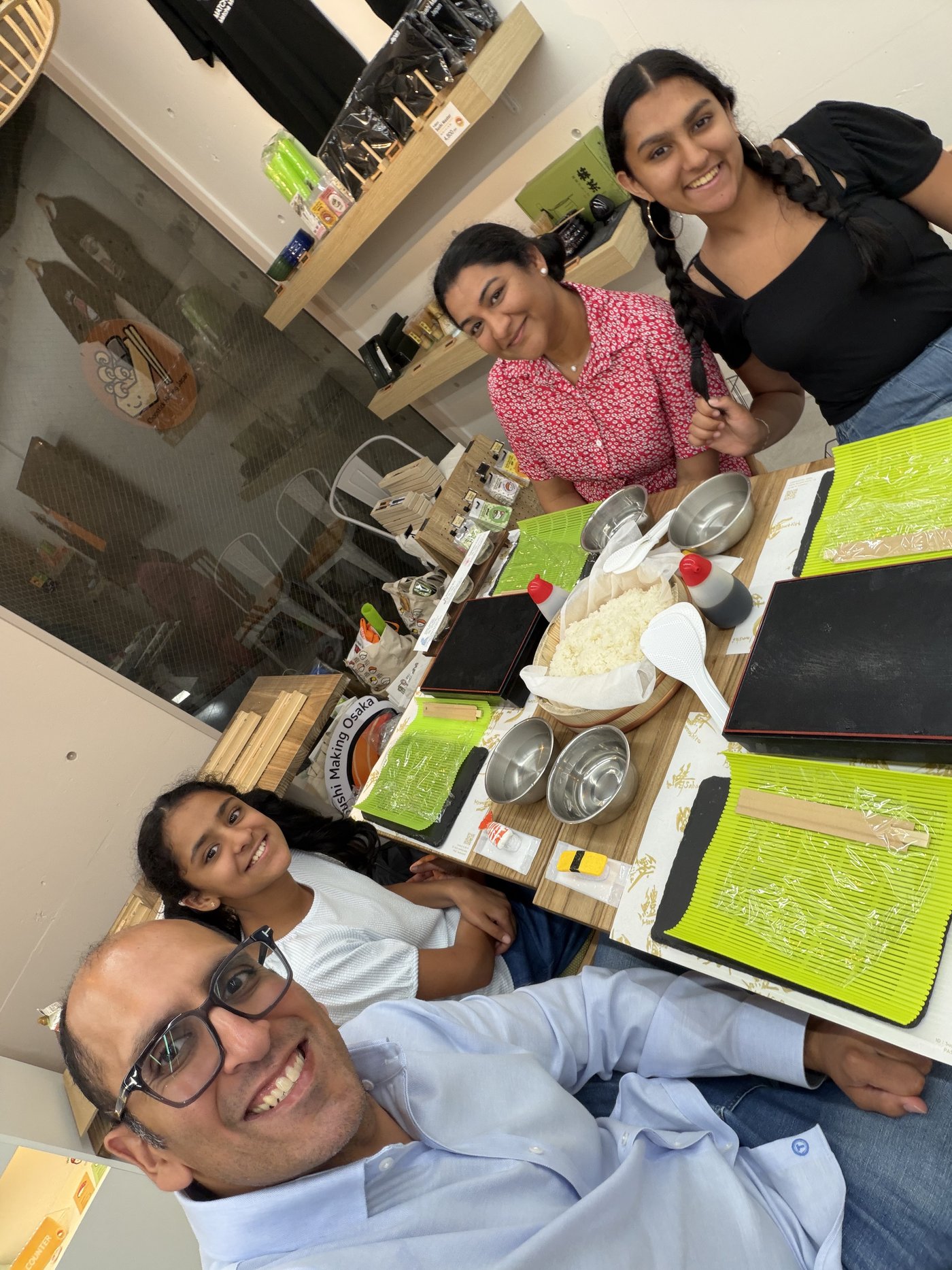 The family at their sushi-making class in Osaka